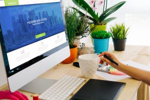 desk with computer and pen tablet website design